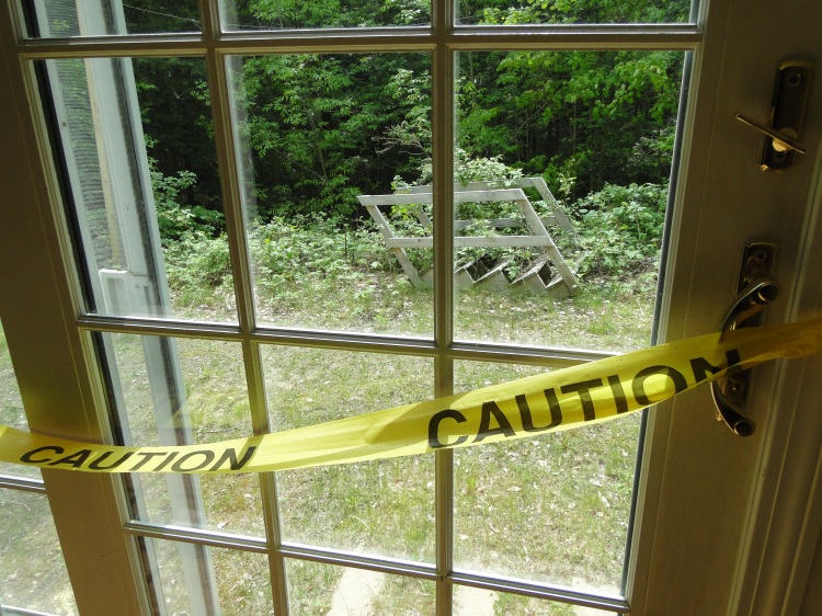 glass slider with caution tape